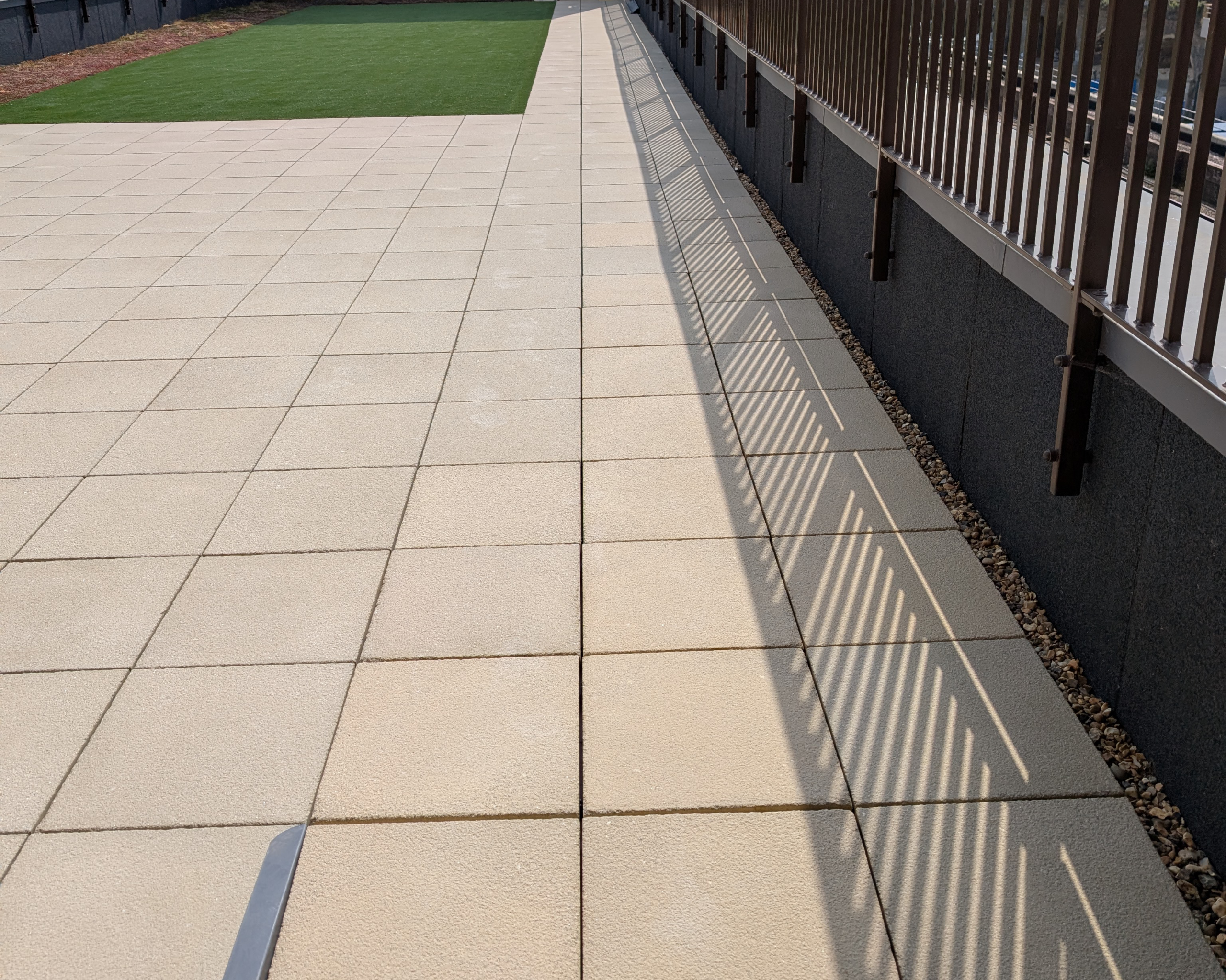Hot Melt Roofing South East – rooftop terrace with paving slabs installed over hot melt system