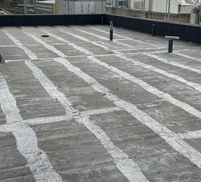 Hot Melt Roofing South East – primed flat roof deck prepared for hot melt waterproofing with vent upstands