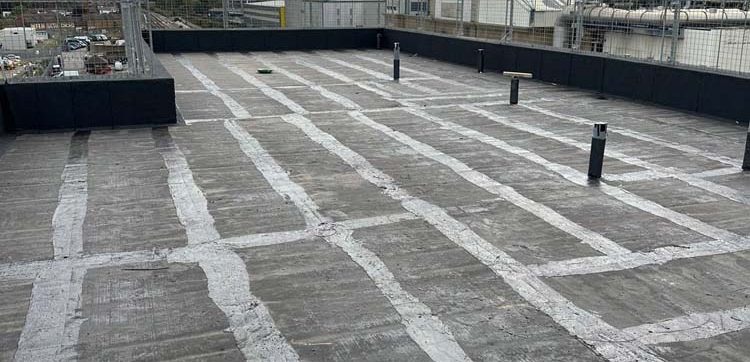 Hot Melt Roofing South East – primed flat roof deck prepared for hot melt waterproofing with vent upstands